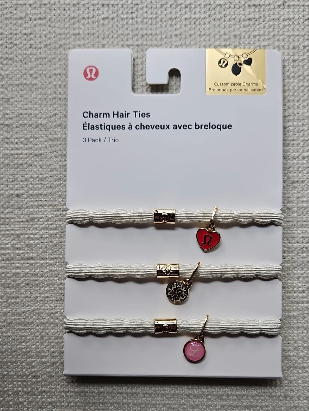 lululemon athletica Charm Hair Ties Trio — White Bands with Red & Pink Charms